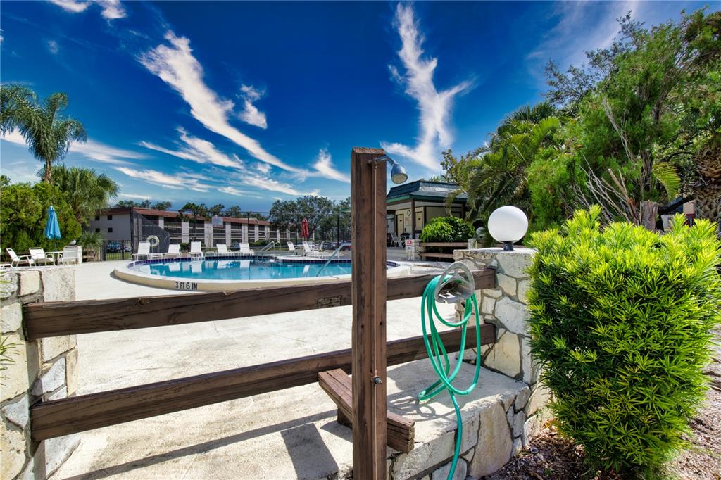 102 Capri Isles Boulevard, Unit 207 Venice, FL 34292 - Photo 23 of 25 a outdoor view with a sitting space