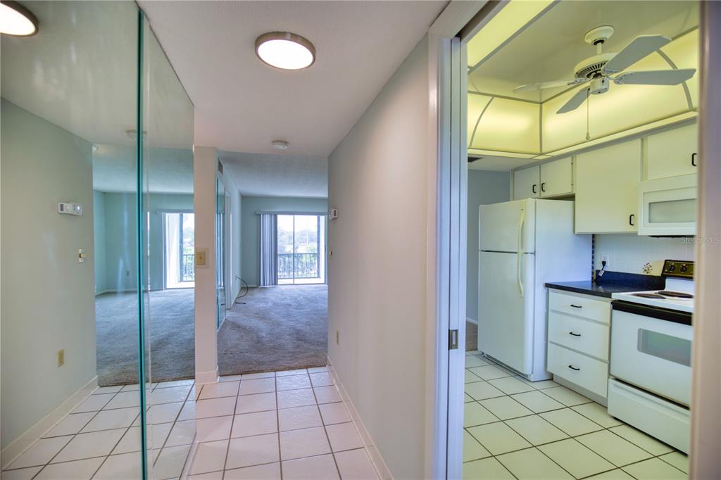 102 Capri Isles Boulevard, Unit 207 Venice, FL 34292 - Photo 5 of 25 a bathroom with a sink and mirror