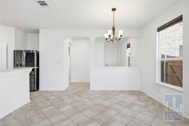 a view of a kitchen with a sink and dishwasher in kitchen with window