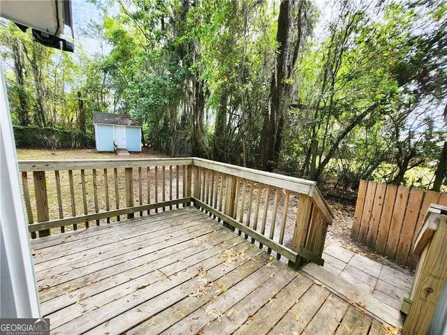 a view of a swimming pool with an outdoor space and seating area
