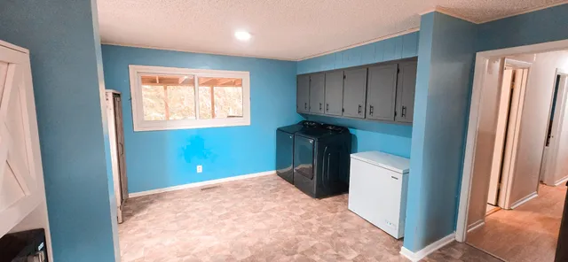 a view of hallway with washer and dryer