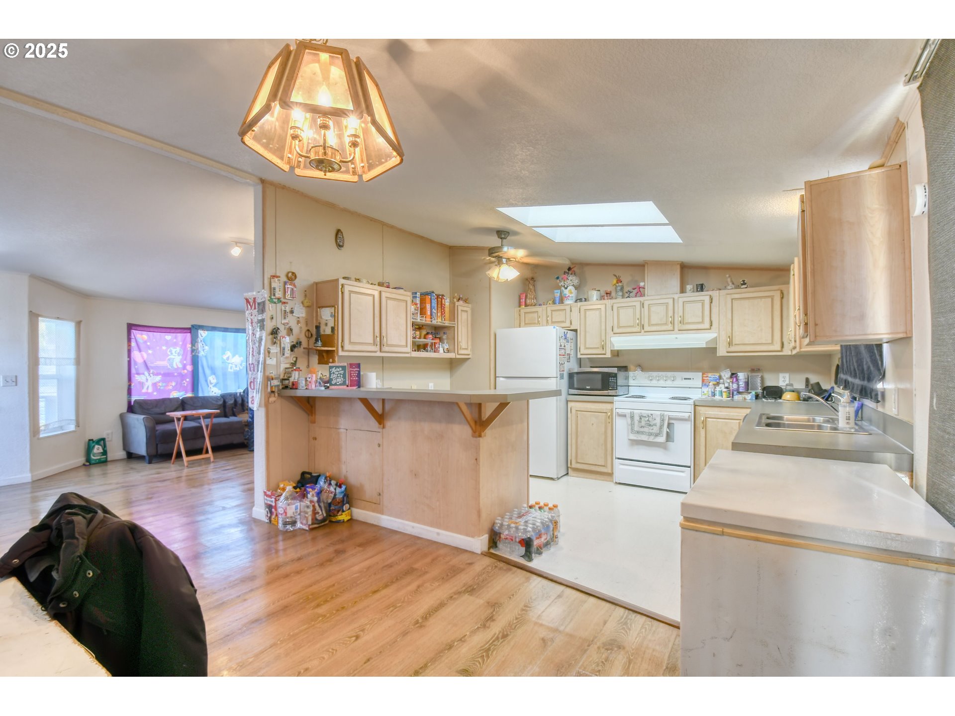 424 East High Street Athena, OR 97813 - Photo 14 of 40 a living room with stainless steel appliances kitchen island granite countertop furniture and a fireplace