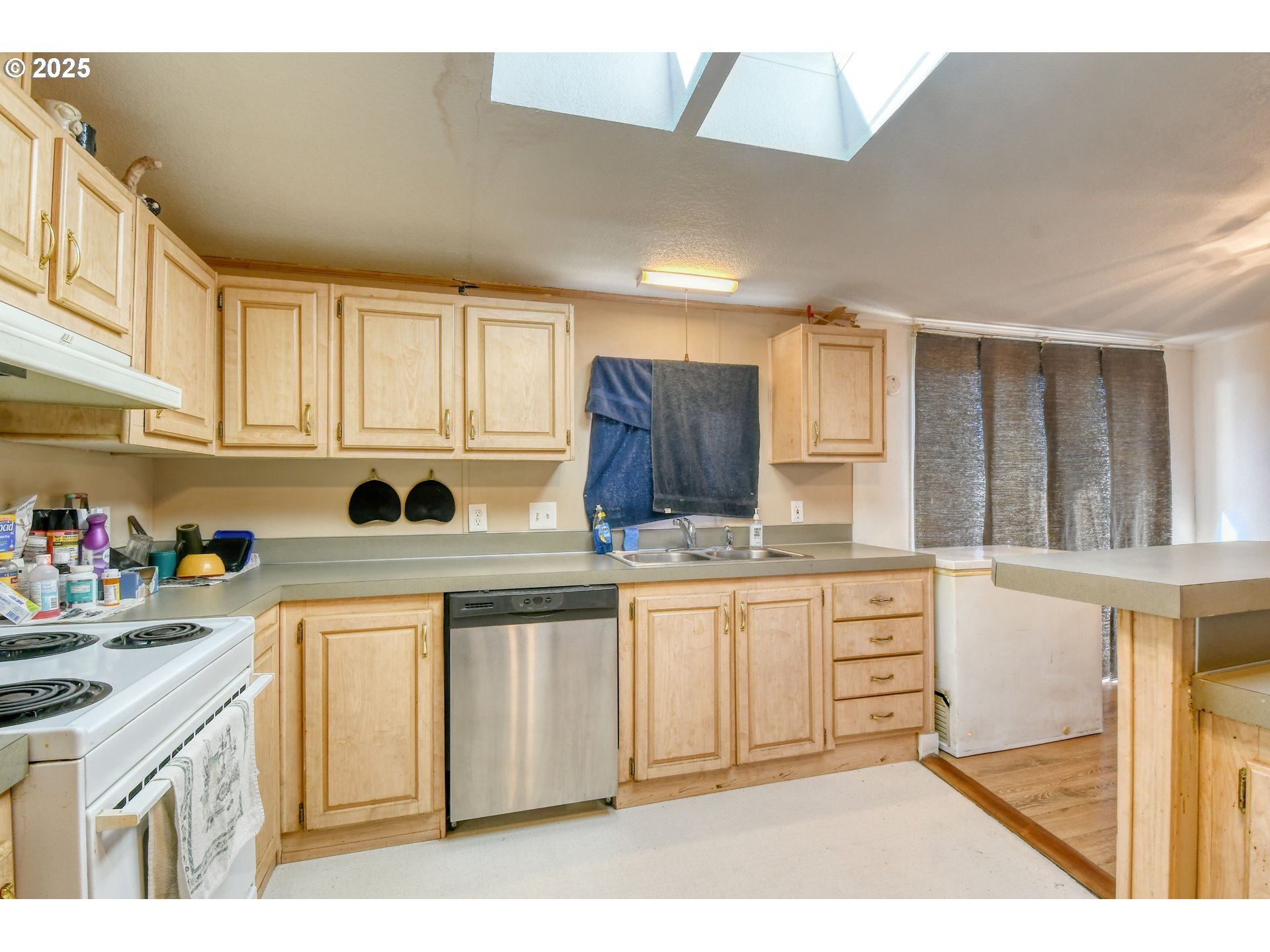 424 East High Street Athena, OR 97813 - Photo 17 of 40 a kitchen with stainless steel appliances granite countertop a stove a sink and white cabinets