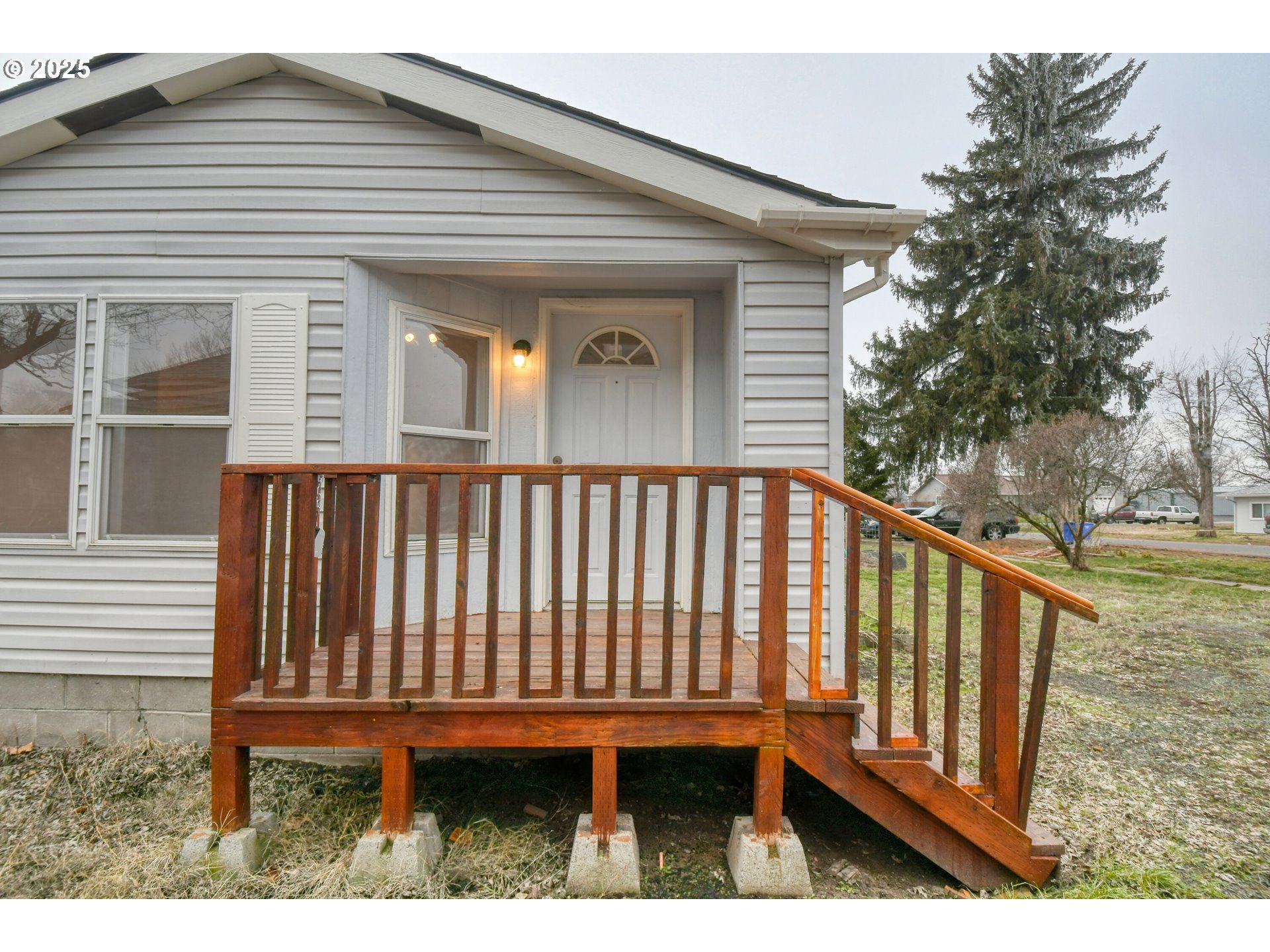 424 East High Street Athena, OR 97813 - Photo 4 of 40 a view of a wooden house with a wooden deck