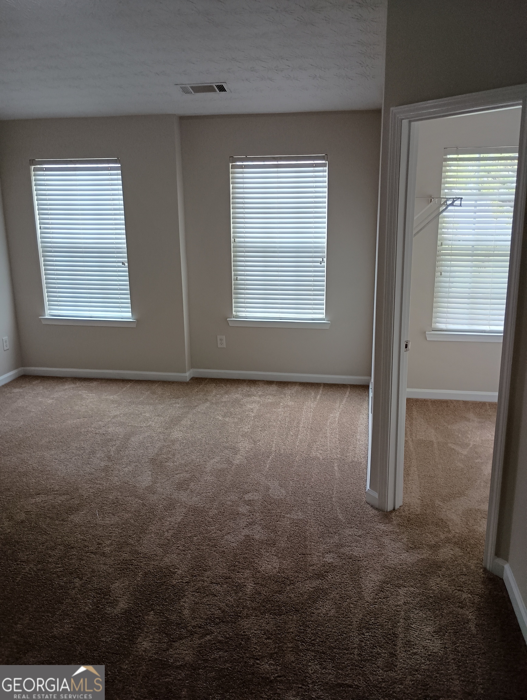 2941 Vining Ridge Terrace Decatur, GA 30034 - Photo 11 of 18 an empty room with windows