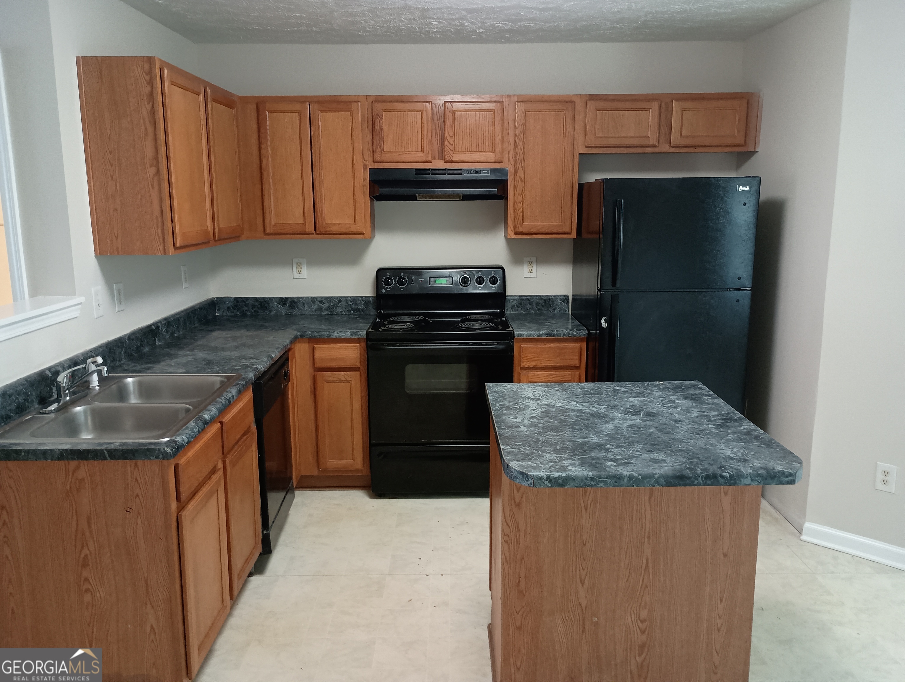 2941 Vining Ridge Terrace Decatur, GA 30034 - Photo 17 of 18 a kitchen with stainless steel appliances granite countertop a sink stove and refrigerator
