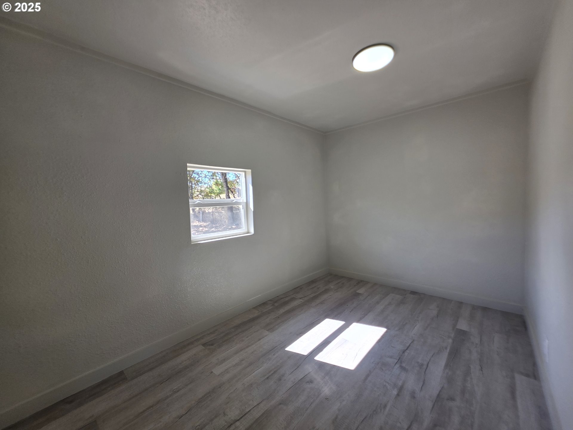 510 Boyer Road Riddle, OR 97469 - Photo 12 of 31 an empty room with a window