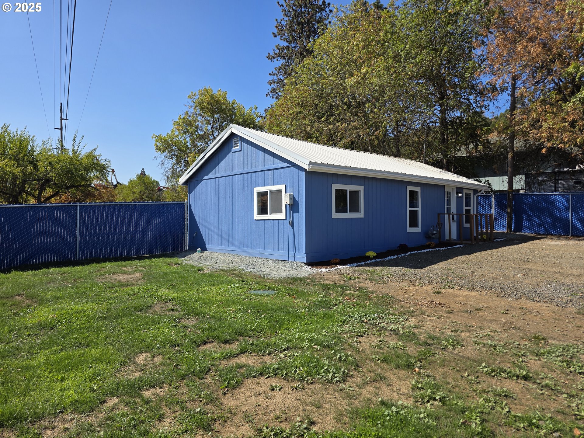 510 Boyer Road Riddle, OR 97469 - Photo 3 of 31 a view of a yard with wooden fence