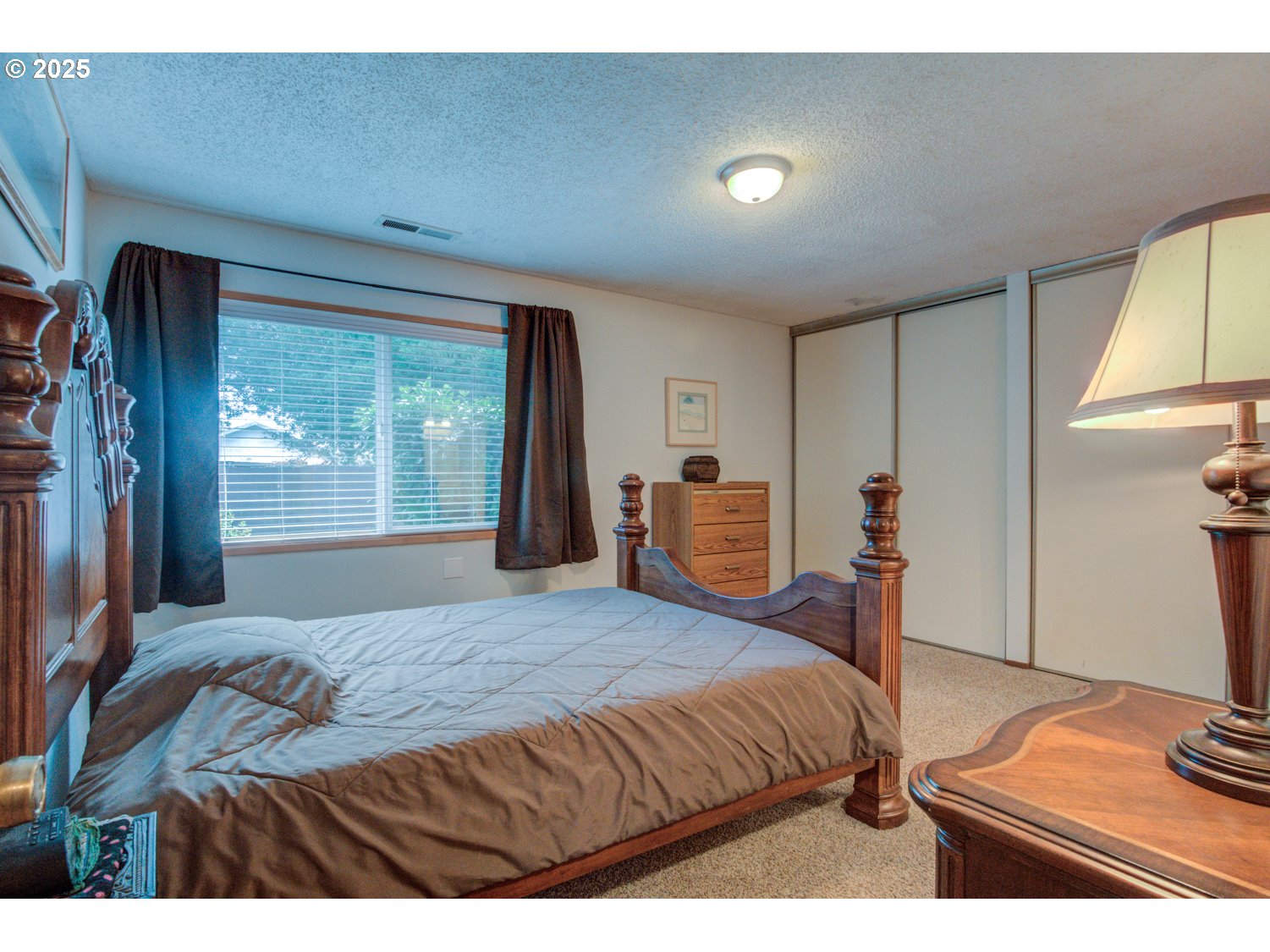 1620 26th Street Florence, OR 97439 - Photo 12 of 27 a bedroom with a bed and a window