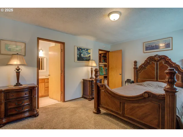 a bathroom with a sink toilet a mirror and shower curtain