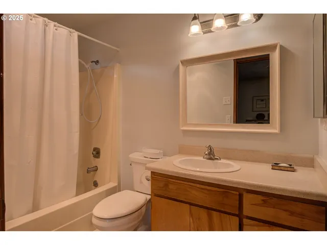 a view of a workspace with furniture and chandelier