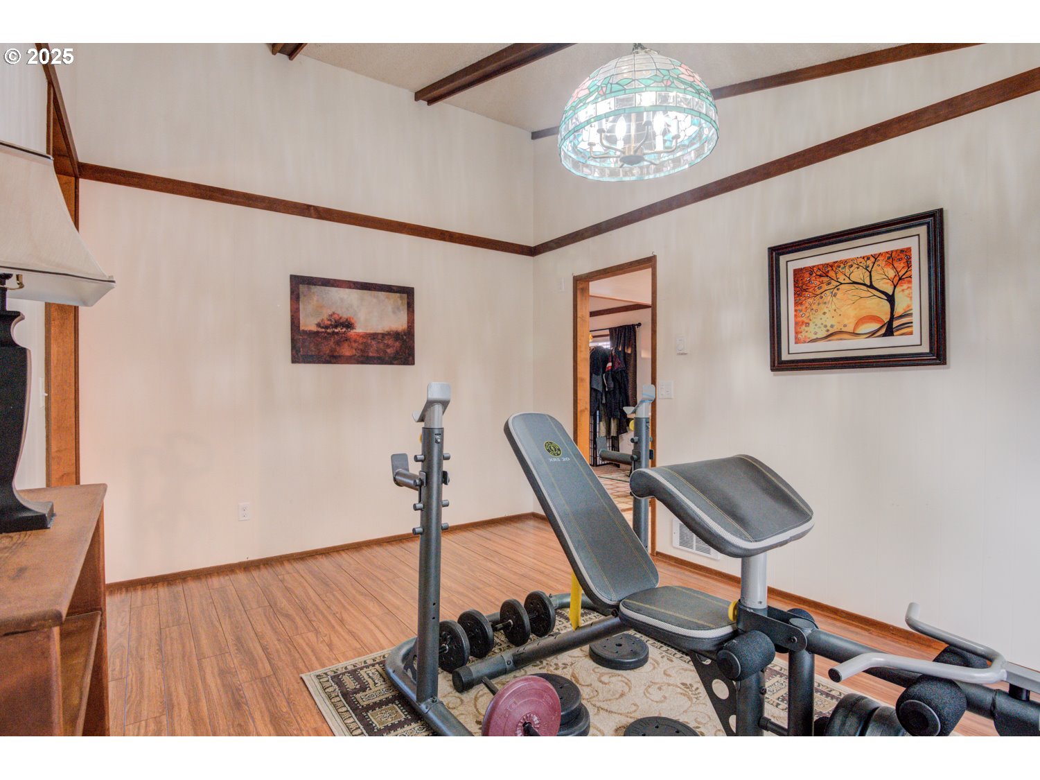 1620 26th Street Florence, OR 97439 - Photo 15 of 27 a view of a workspace with furniture and chandelier