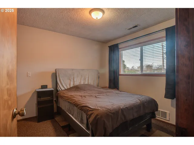 a bedroom with a bed and a closet