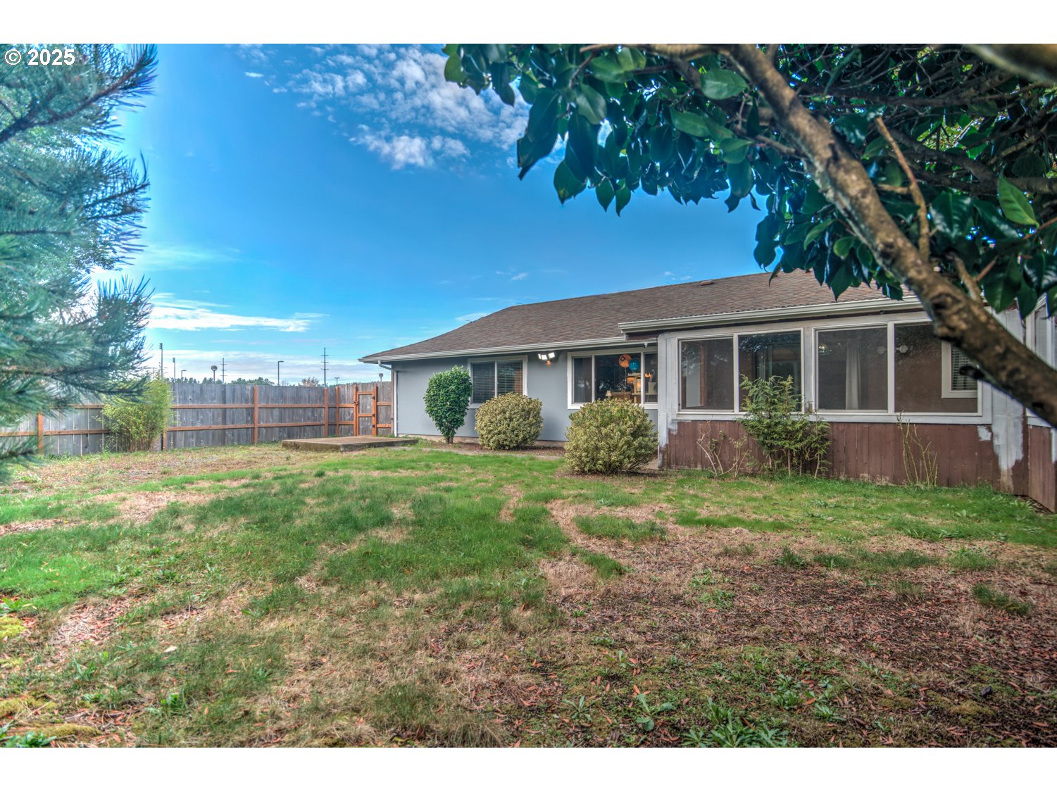 1620 26th Street Florence, OR 97439 - Photo 25 of 27 a view of a house with backyard and sitting area