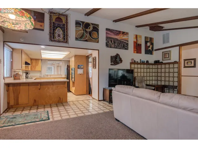 a living room with furniture and a rug