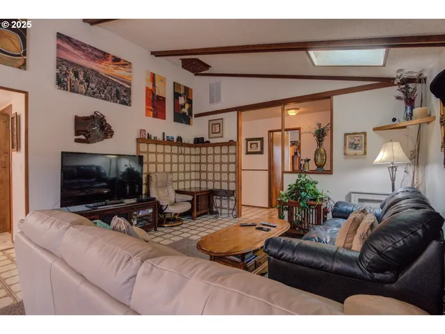 a kitchen with a stove a sink a refrigerator and cabinets