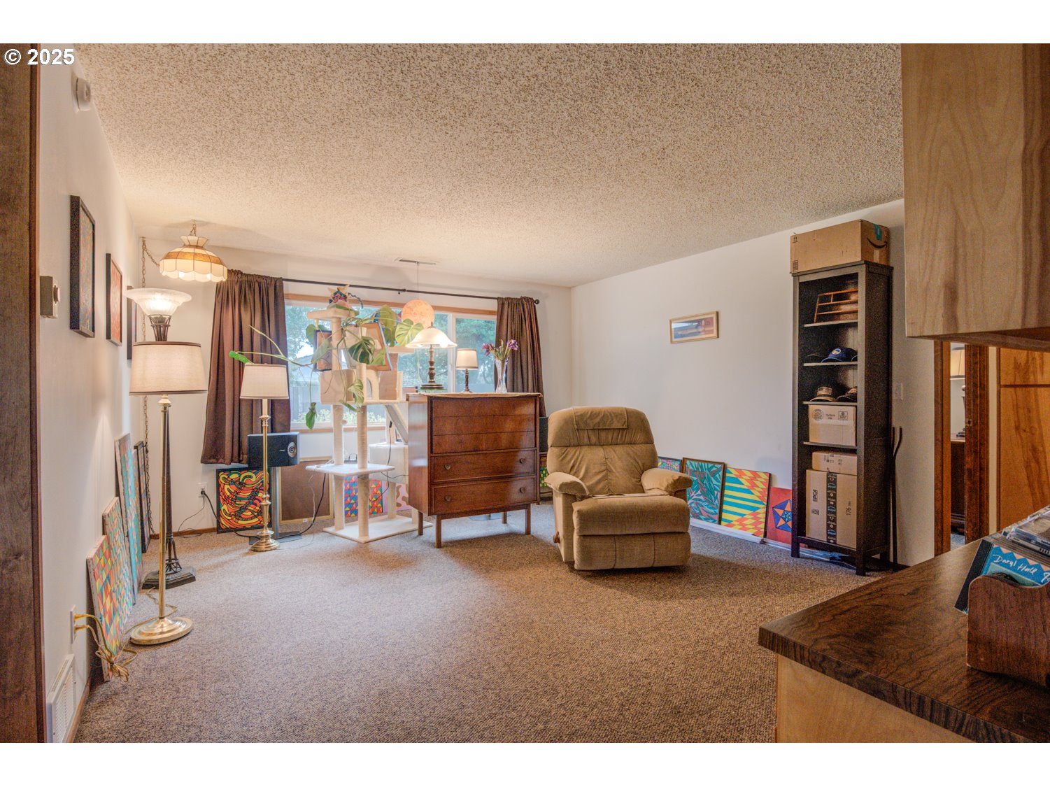 1620 26th Street Florence, OR 97439 - Photo 10 of 27 a bedroom with furniture and a large window