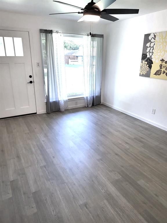 412 Ellis Street Allen, TX 75002 - Photo 20 of 36 an empty room with wooden floor and windows
