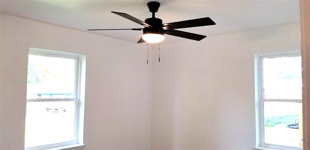 412 Ellis Street Allen, TX 75002 - Photo 24 of 36 a picture of a window with a fan