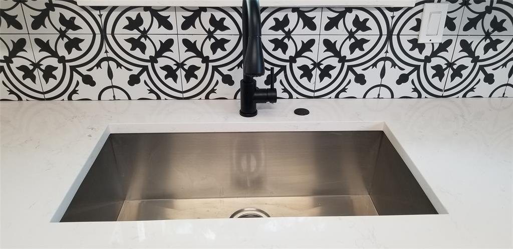 412 Ellis Street Allen, TX 75002 - Photo 6 of 36 a bathroom with a black and white wall