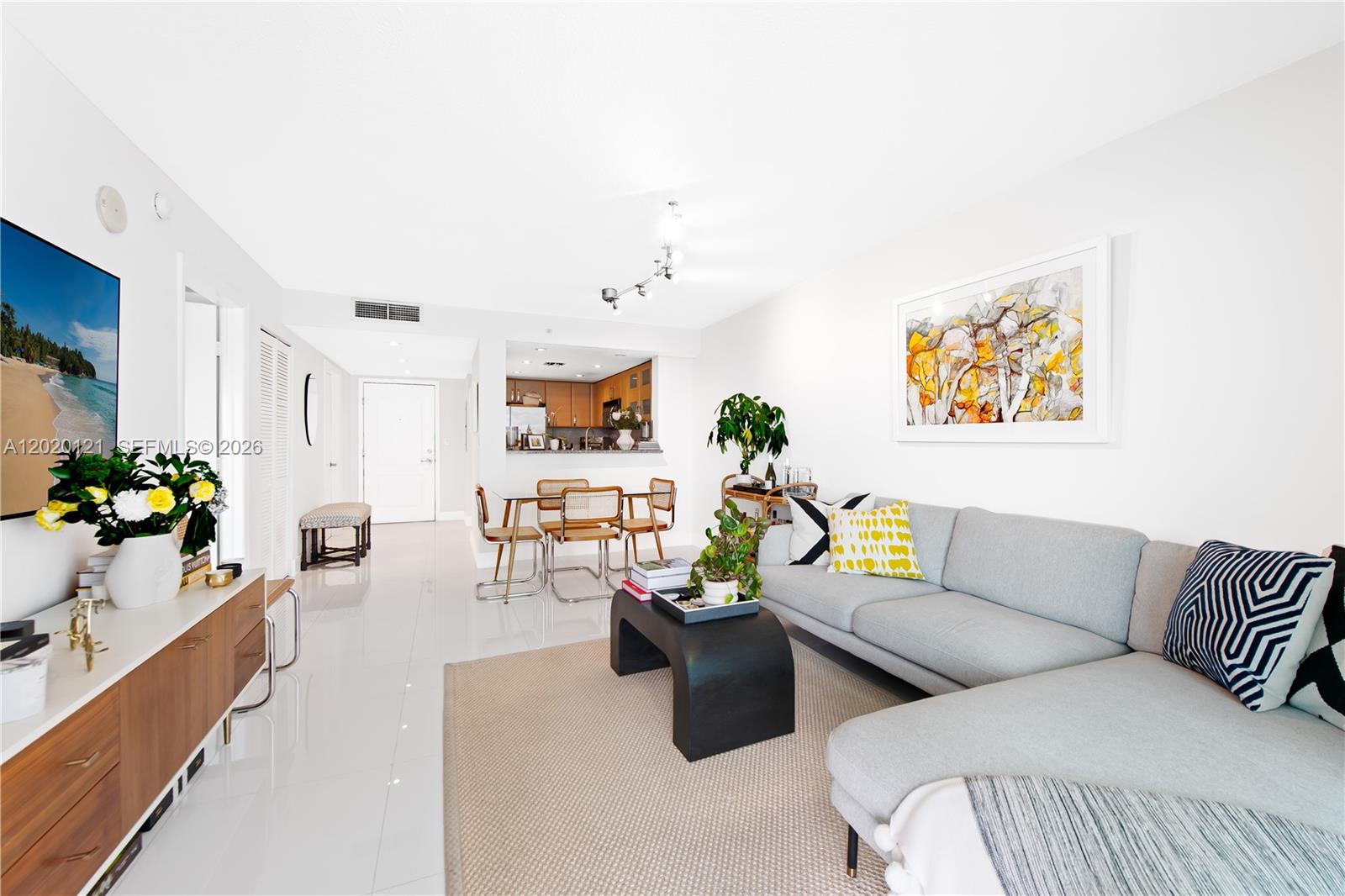 2101 Brickell Avenue, Unit 1909 Miami, FL 33129 - Photo 2 of 25 a living room with furniture and wooden floor