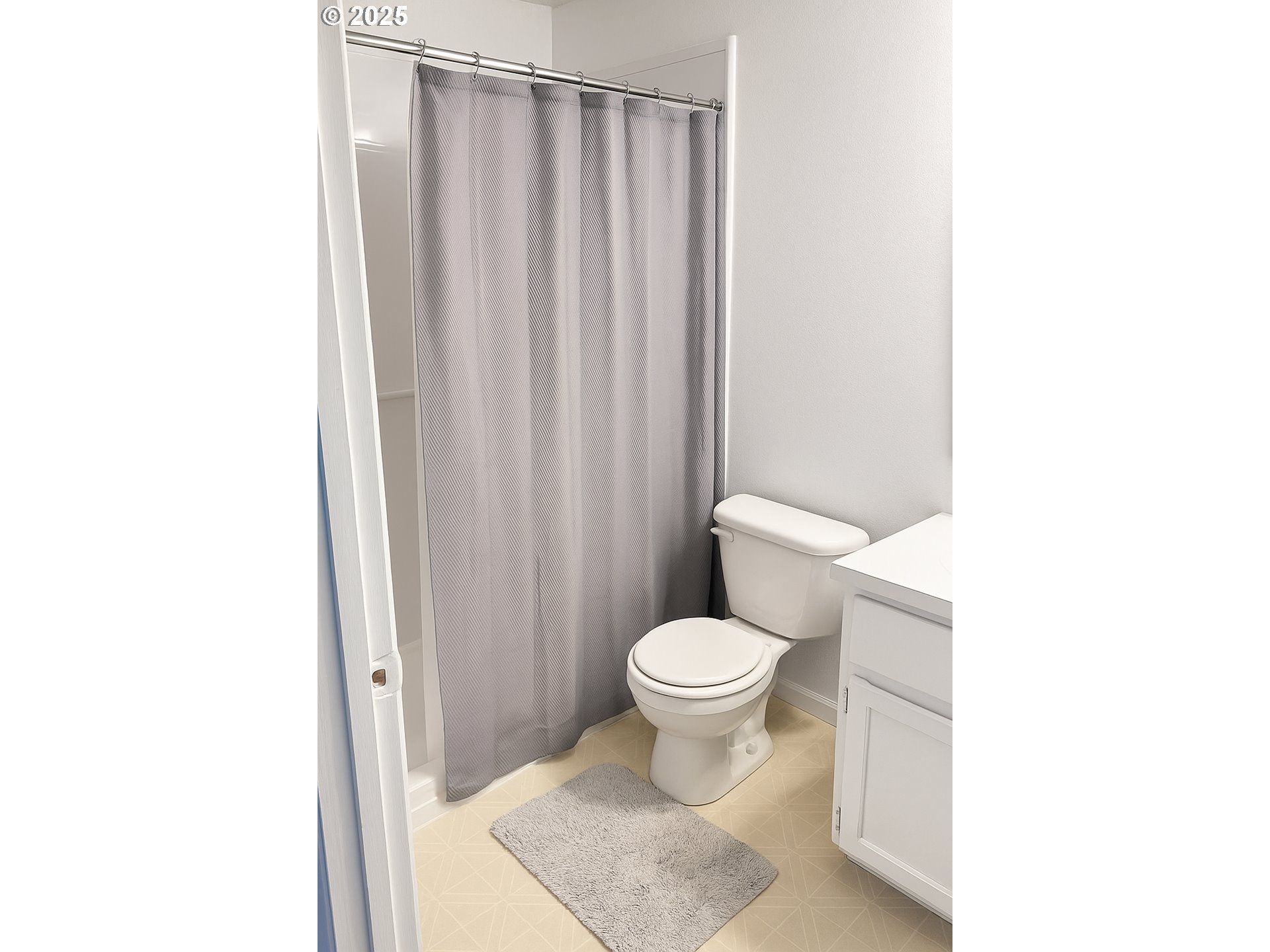 1802 Northwest 3rd Street Battle Ground, WA 98604 - Photo 16 of 16 a bathroom with a toilet a sink and a shower