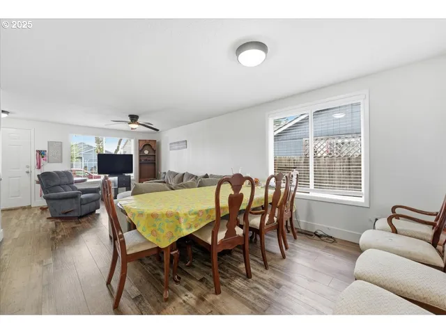 a dining room with furniture and window