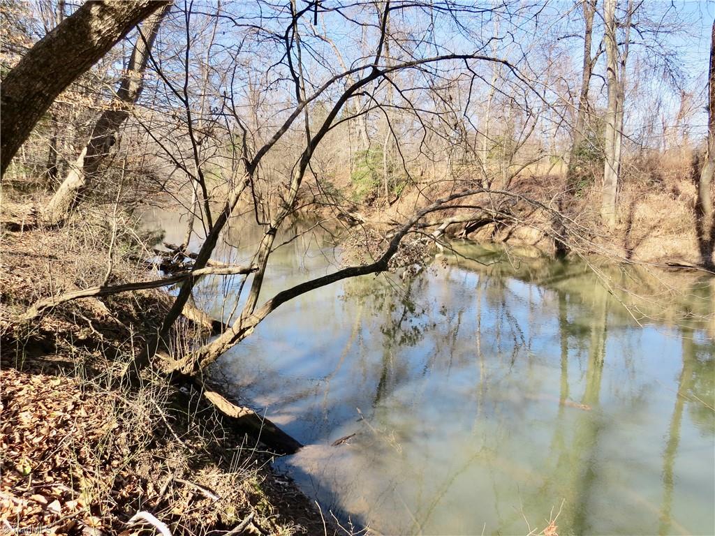 333 Haw Road Browns Summit, NC 27214 - Photo 38 of 44 Haw river and property line at the back left corner of the property.