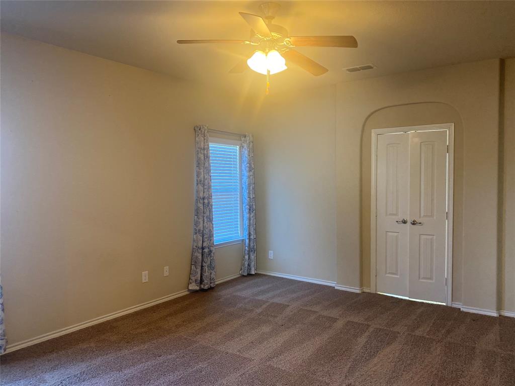 1220 Scott Drive Weatherford, TX 76087 - Photo 24 of 35 bedroom with double door closet and ceiling fan.