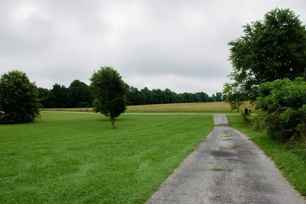 a house view with a sitting space and garden