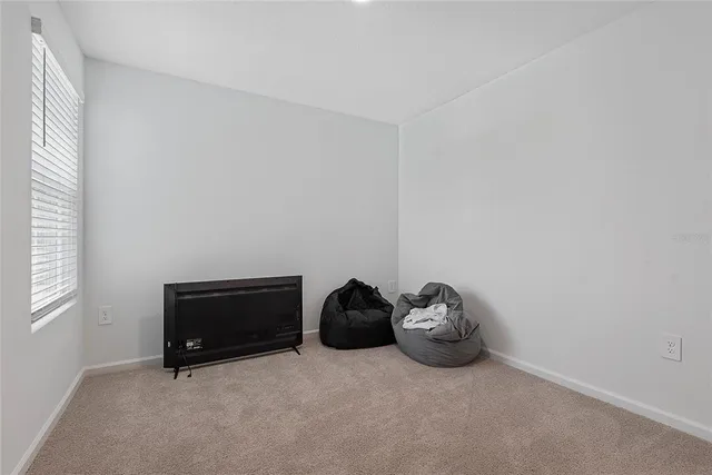 a room with a bed and a window