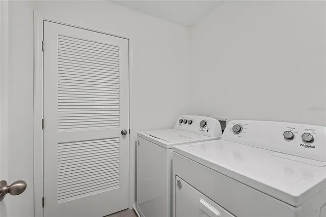 a utility room with dryer and washer