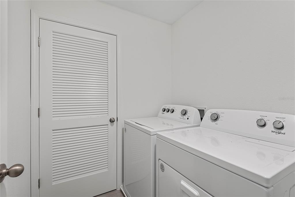 309 Redbud Road Palm Coast, FL 32137 - Photo 29 of 33 a utility room with dryer and washer