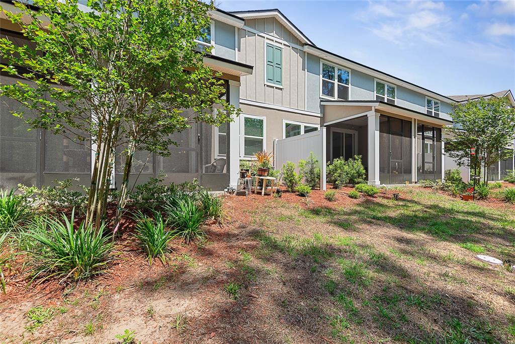 309 Redbud Road Palm Coast, FL 32137 - Photo 32 of 33 a front view of a house with a yard