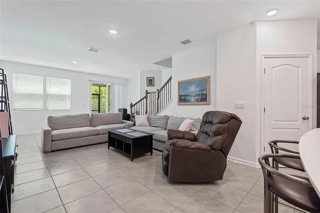 a living room with furniture and a window