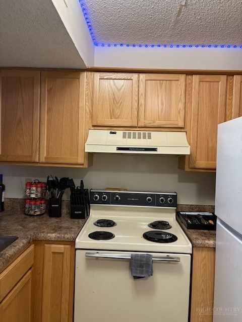 229 East King Street, Unit 31 Boone, NC 28607 - Photo 11 of 26 a kitchen with a stove and a white cabinets