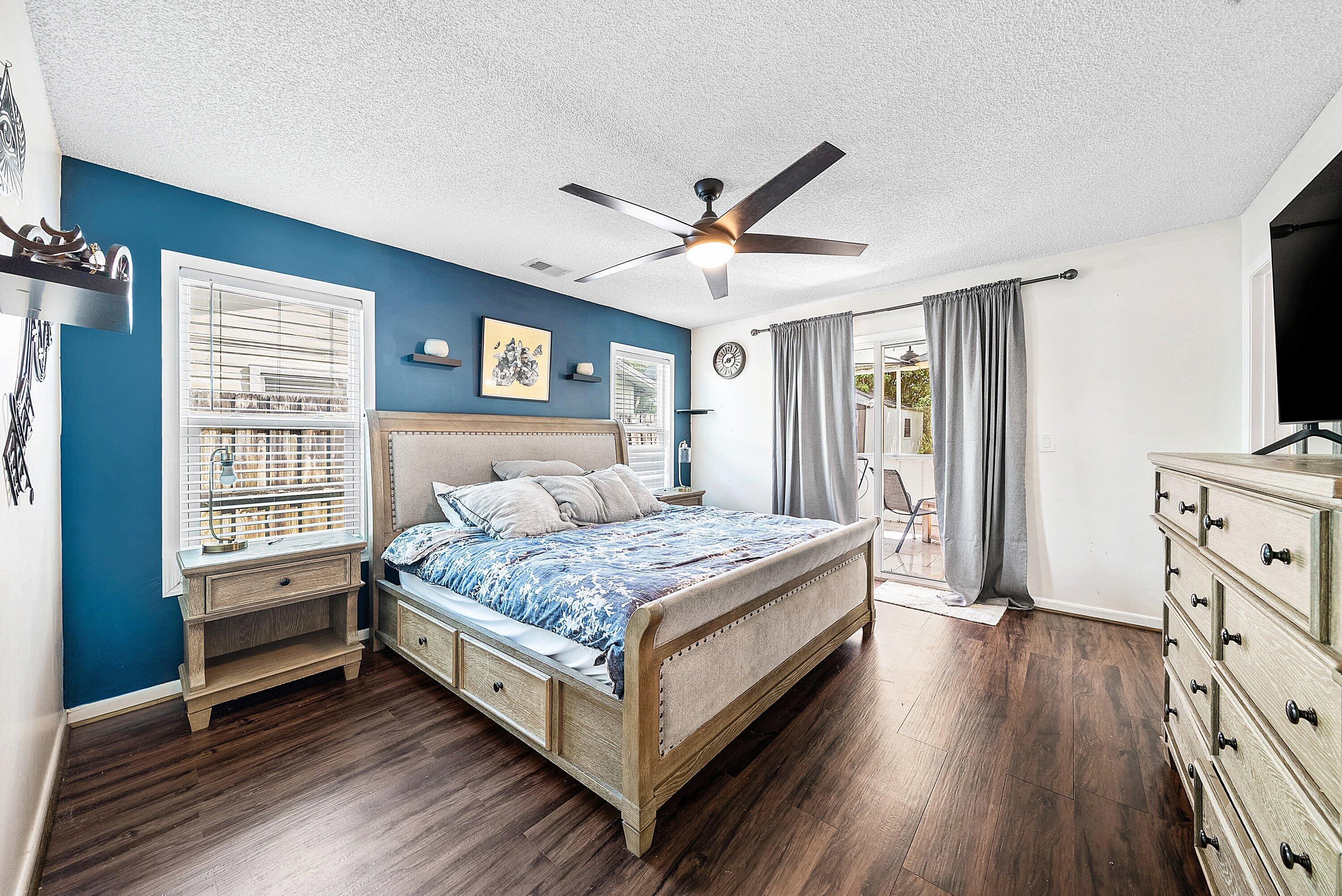 4500 Southeast Salvatori Road Stuart, FL 34997 - Photo 11 of 25 a bedroom with a bed and a flat tv screen on dresser