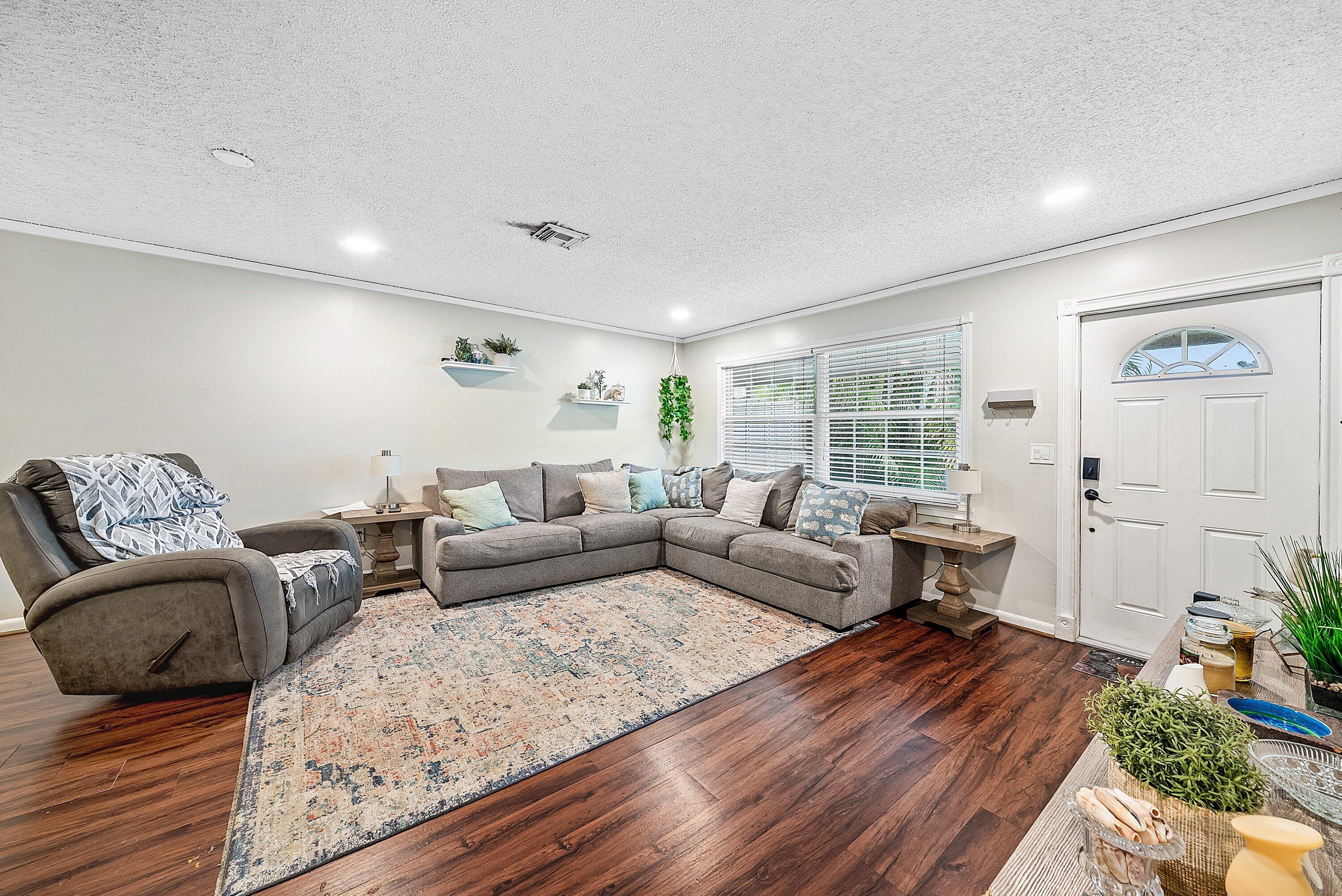 4500 Southeast Salvatori Road Stuart, FL 34997 - Photo 2 of 25 a living room with furniture and wooden floor
