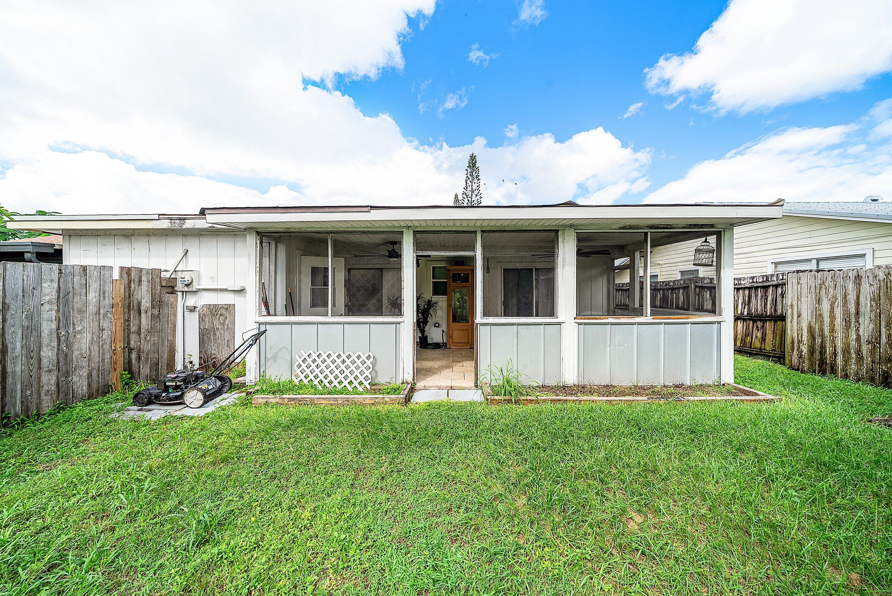 4500 Southeast Salvatori Road Stuart, FL 34997 - Photo 23 of 25 a view of front of house with yard