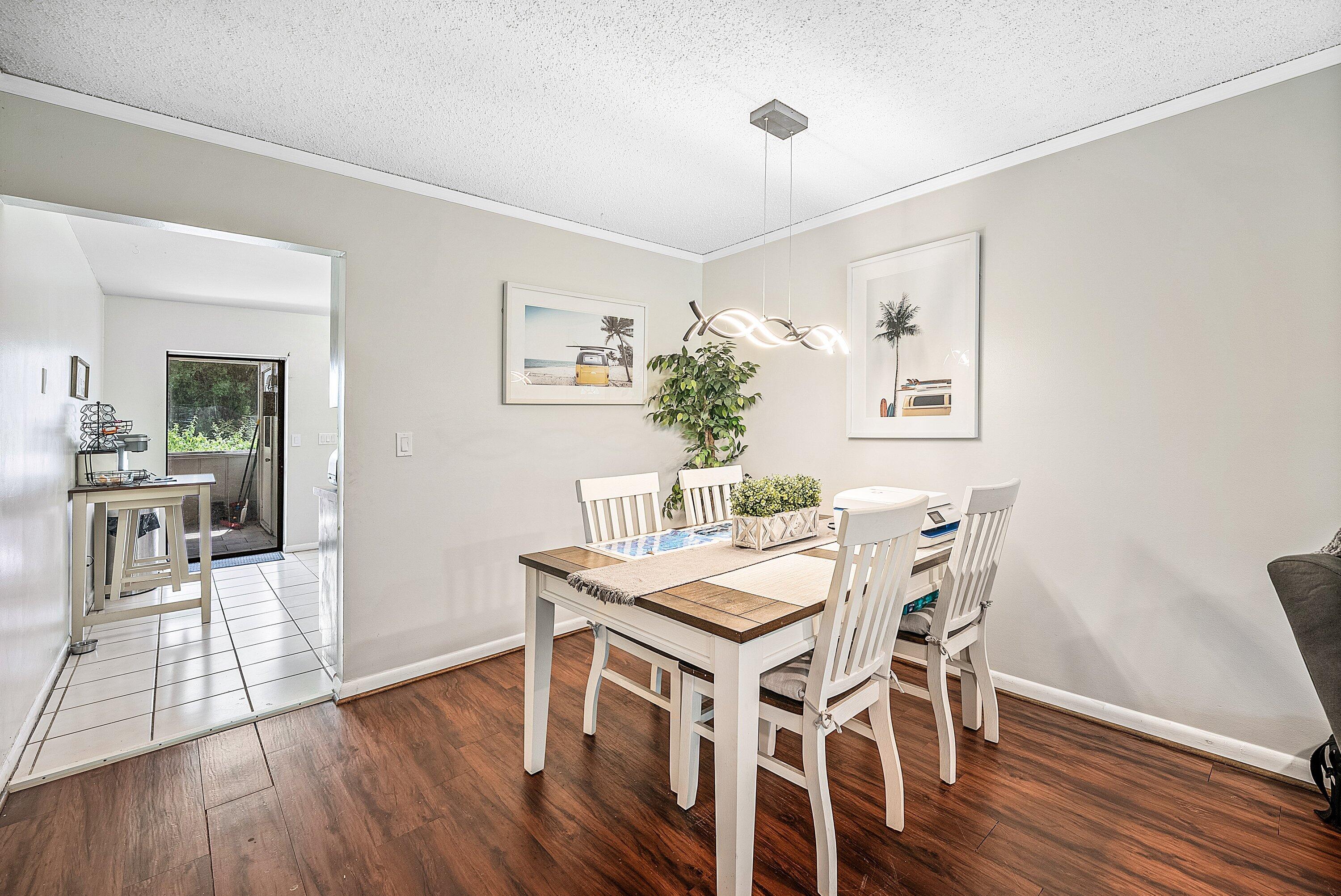 4500 Southeast Salvatori Road Stuart, FL 34997 - Photo 5 of 25 a view of a dining room with furniture and wooden floor