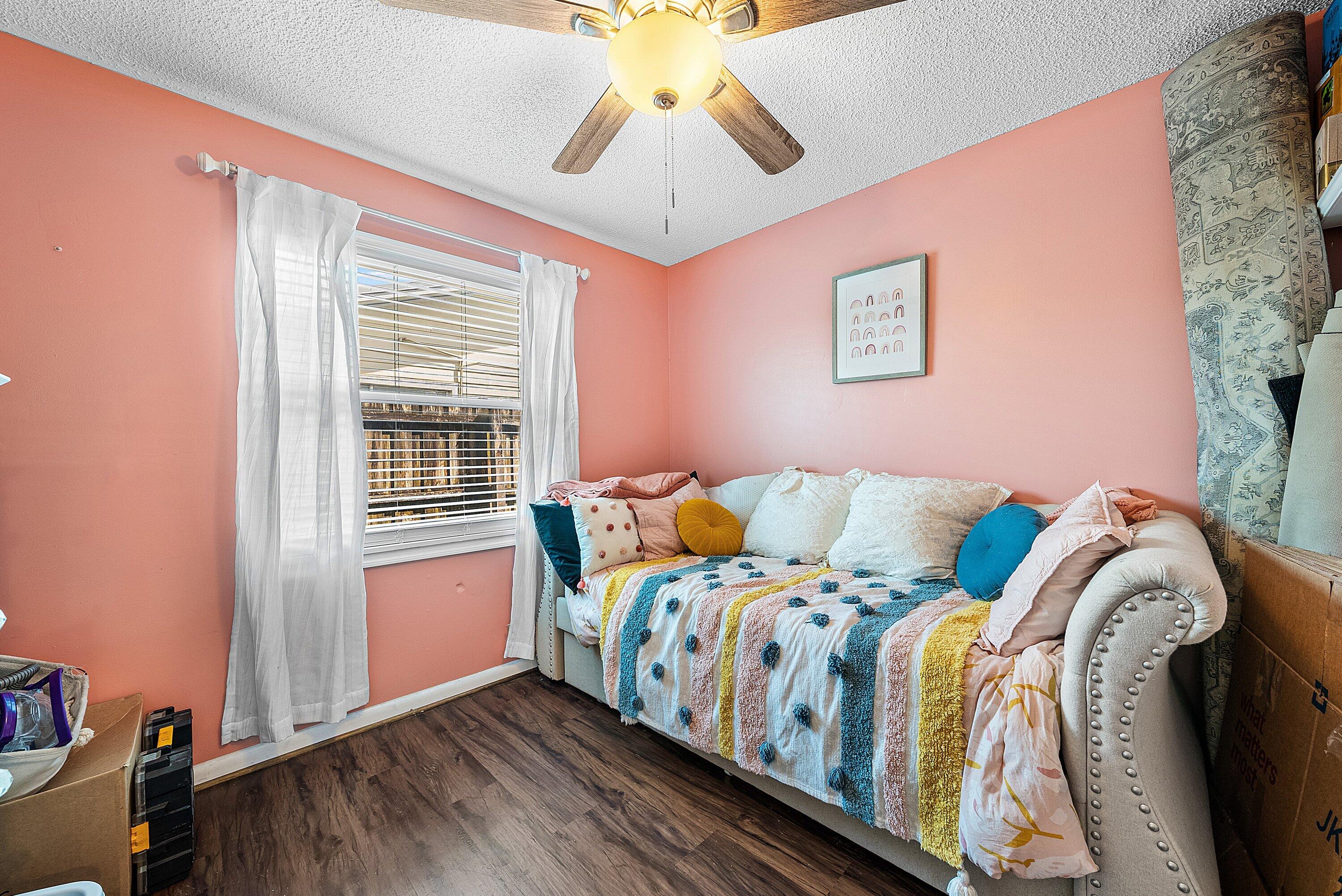 4500 Southeast Salvatori Road Stuart, FL 34997 - Photo 10 of 25 a bed sitting in a bedroom next to a window