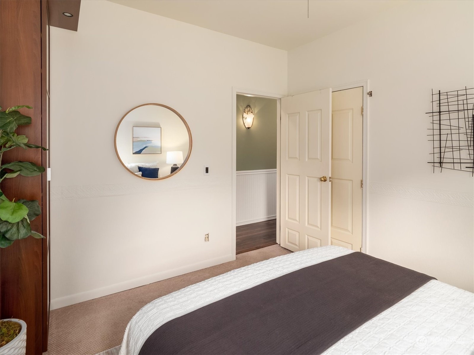 610 Maple Street Edmonds, WA 98020 - Photo 15 of 36 a bedroom with a bed and a potted plant