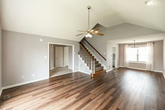 2029 Copper Kettle Circle Pleasant View, TN 37146 - Photo 13 of 58 a view of an empty room with wooden floor stairs and a window