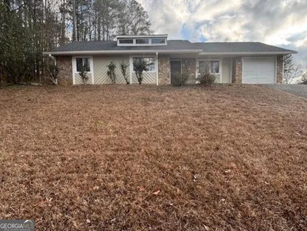 a front view of a house with yard