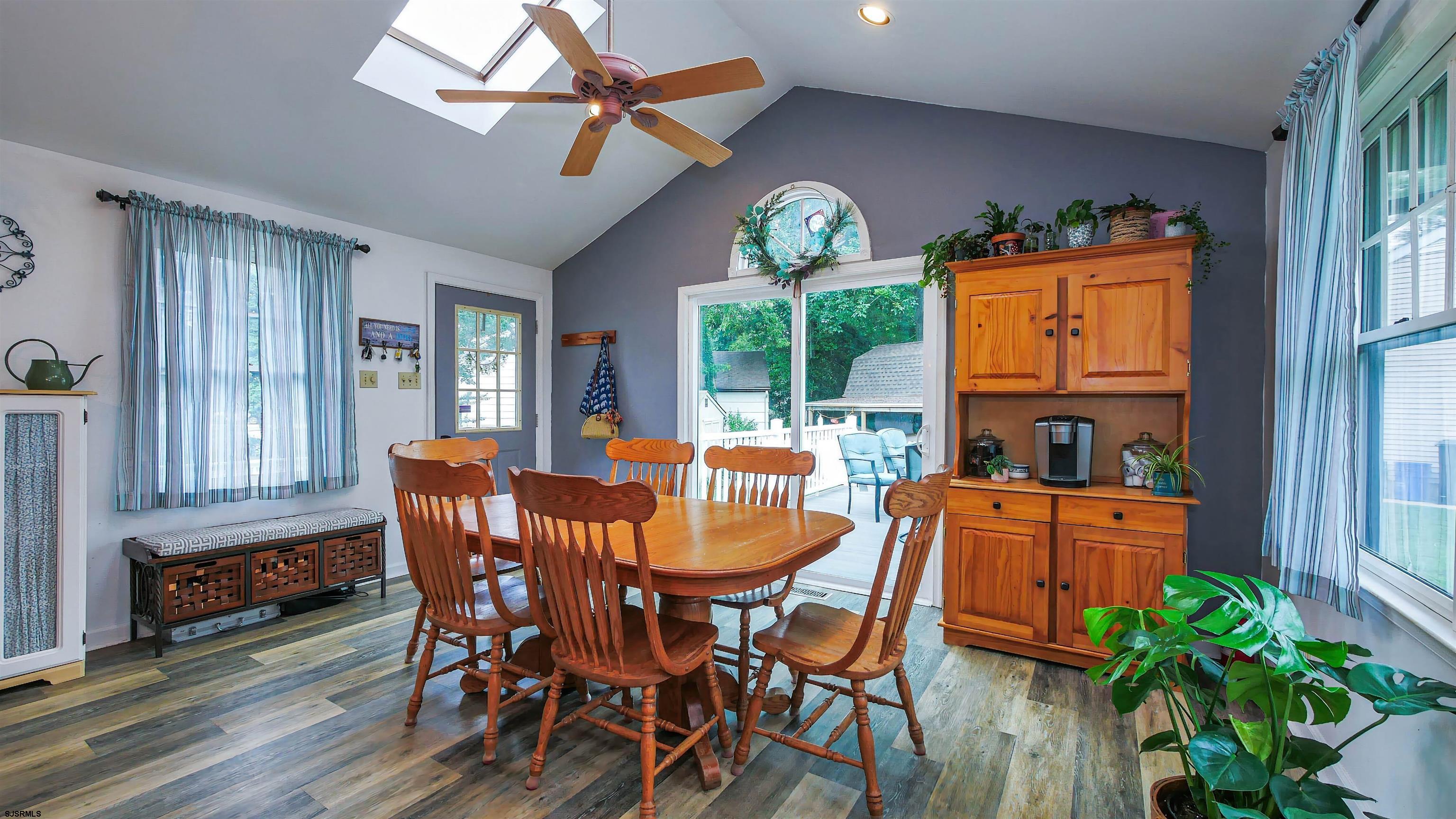2 Rose Lane Somers Point, NJ 08244 - Photo 11 of 43 a dining room with furniture a window and a chandelier
