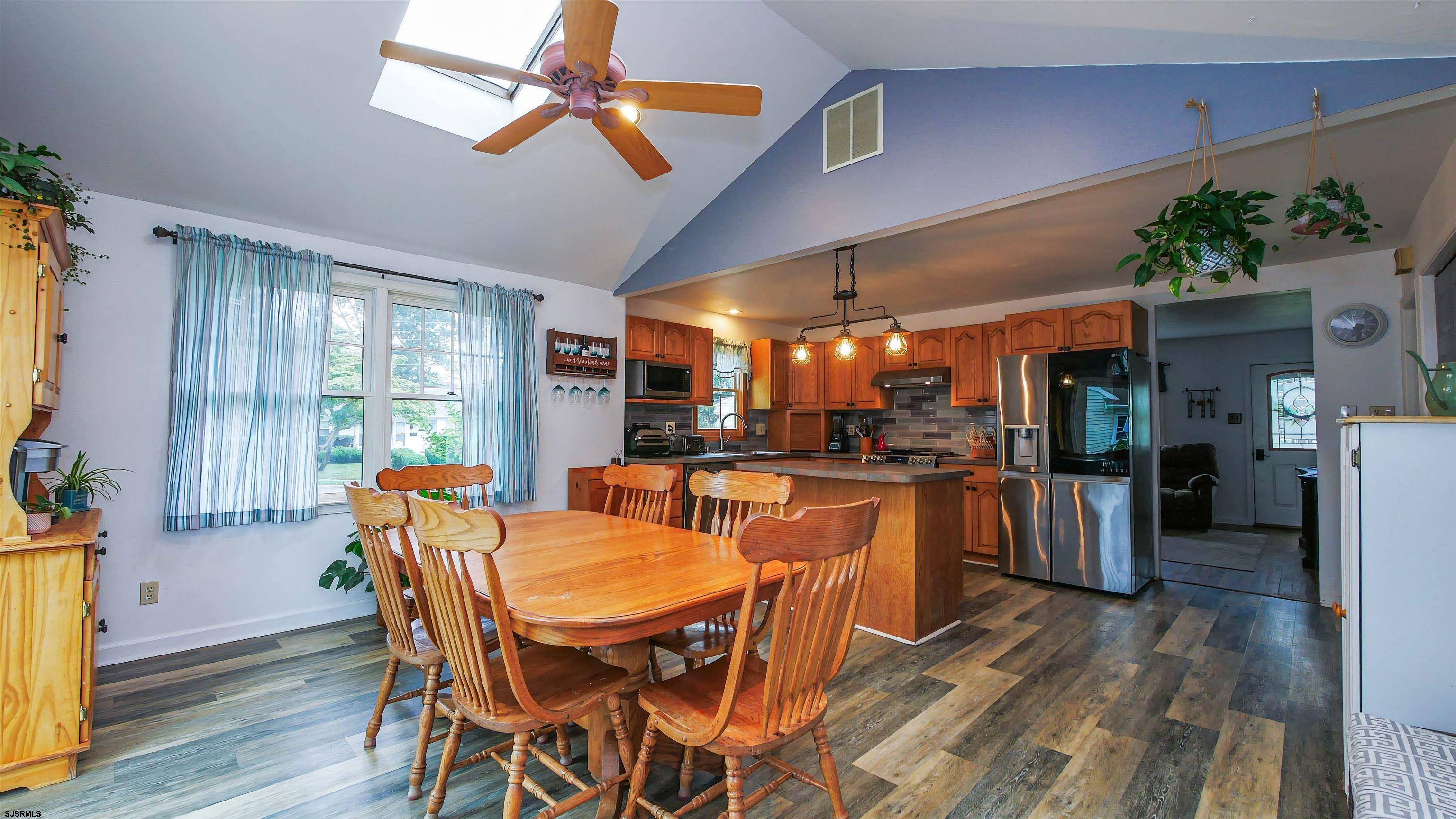 2 Rose Lane Somers Point, NJ 08244 - Photo 12 of 43 a dining room with furniture a window and wooden floor