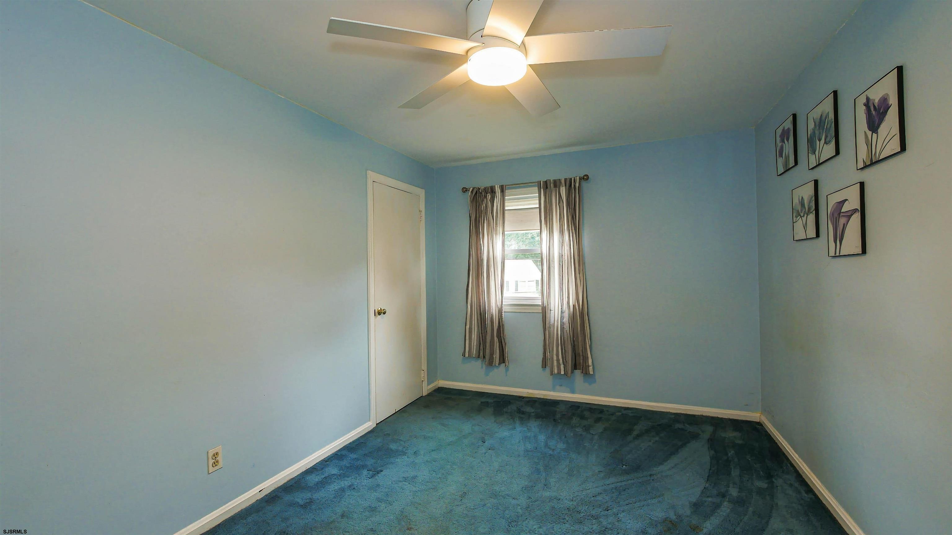 2 Rose Lane Somers Point, NJ 08244 - Photo 21 of 43 an empty room with windows and fan
