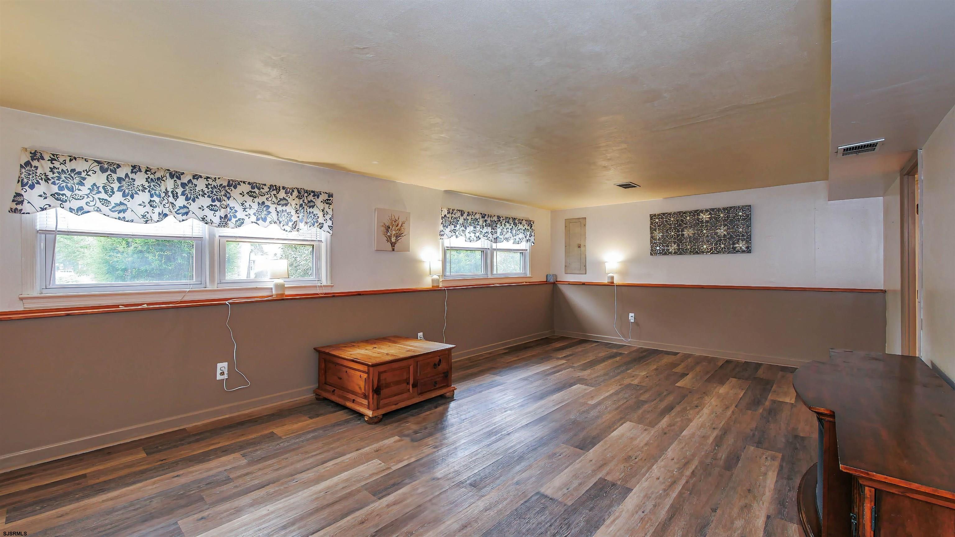 2 Rose Lane Somers Point, NJ 08244 - Photo 22 of 43 a view of room with window and wooden floor