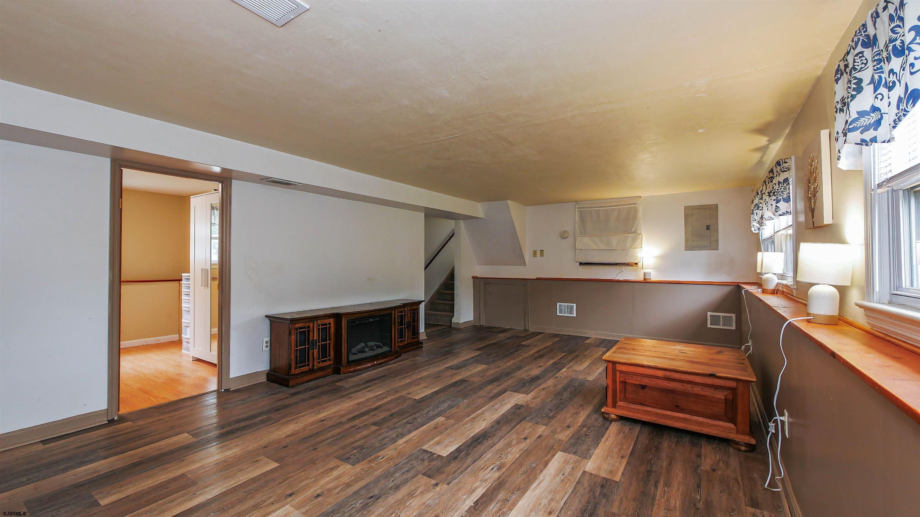2 Rose Lane Somers Point, NJ 08244 - Photo 23 of 43 a living room with furniture and a fireplace