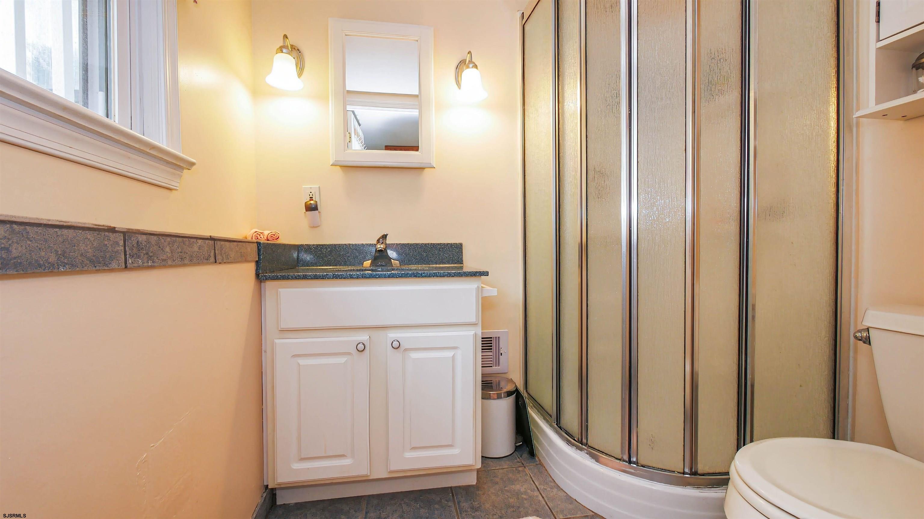 2 Rose Lane Somers Point, NJ 08244 - Photo 27 of 43 a bathroom with a sink a toilet and shower